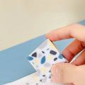 White rubber brick-format eraser for students on a plain background