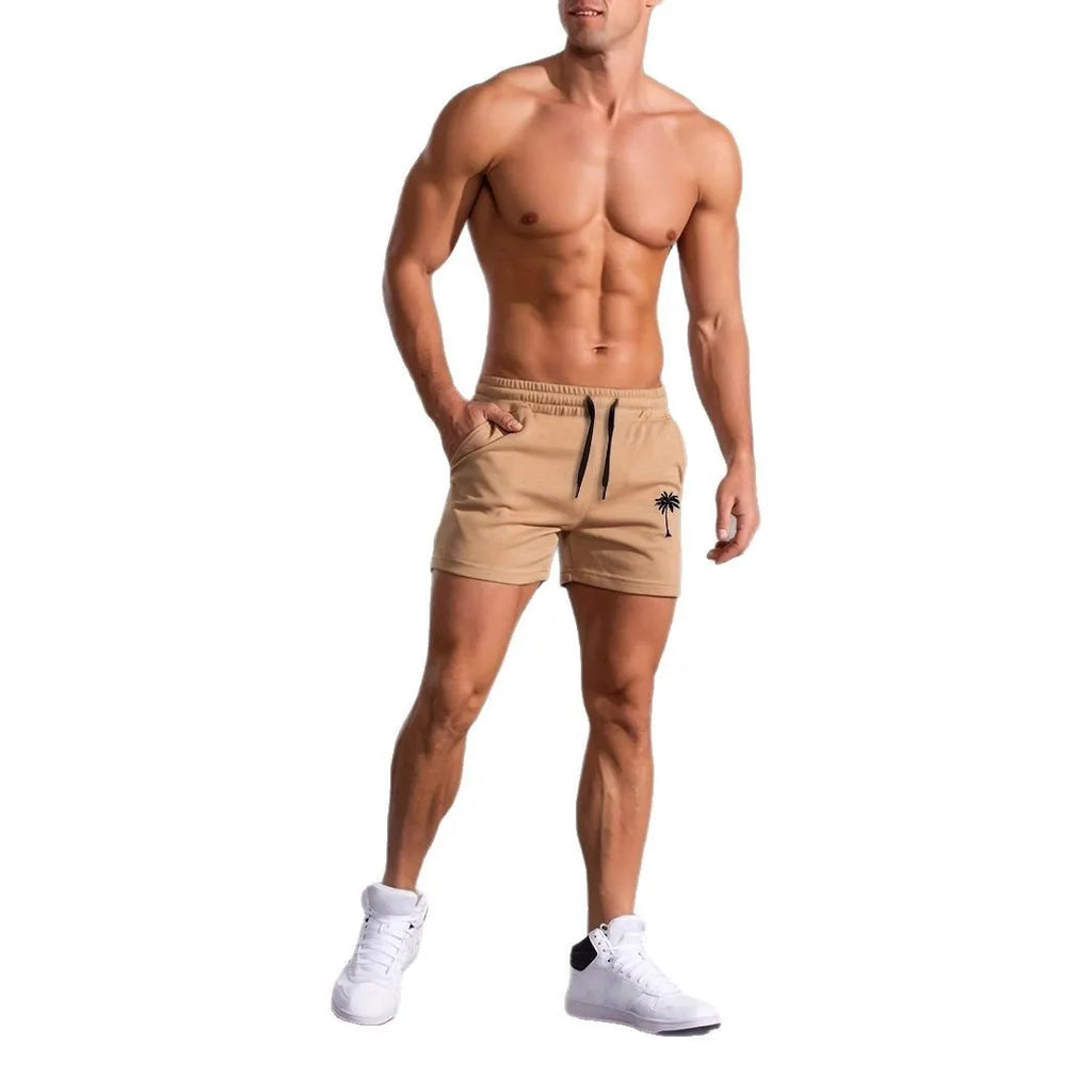 Men's khaki sports shorts with coconut palm leaf print, elastic waistband, straight cut design