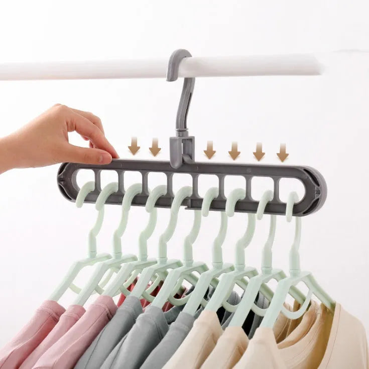 Plastic clothes hanger with rotating hook showing pink and green colour options