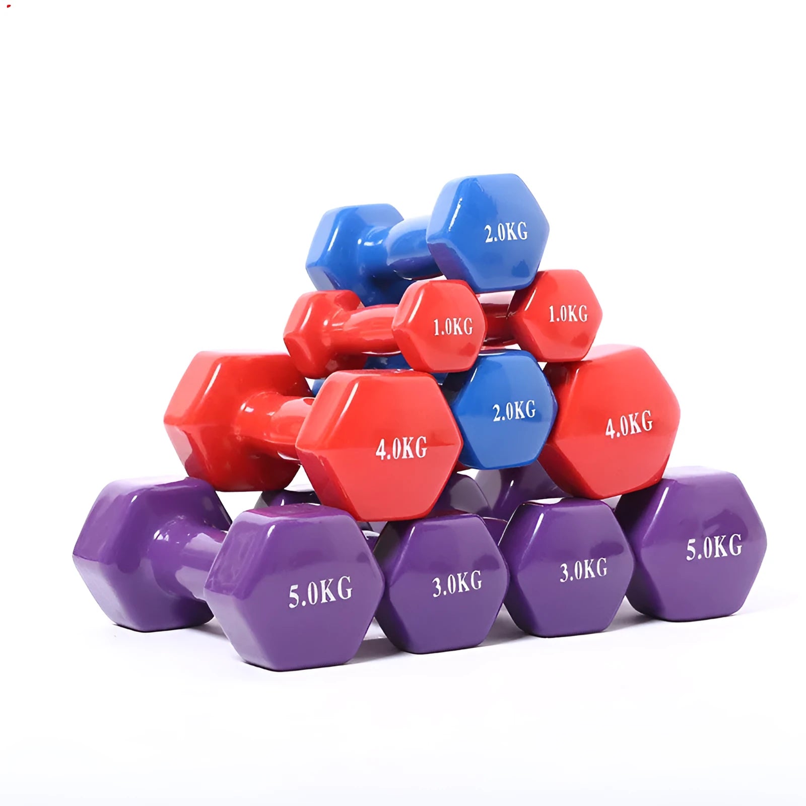 A set of bright green and pink plastic fitness dumbbells on a wooden floor.