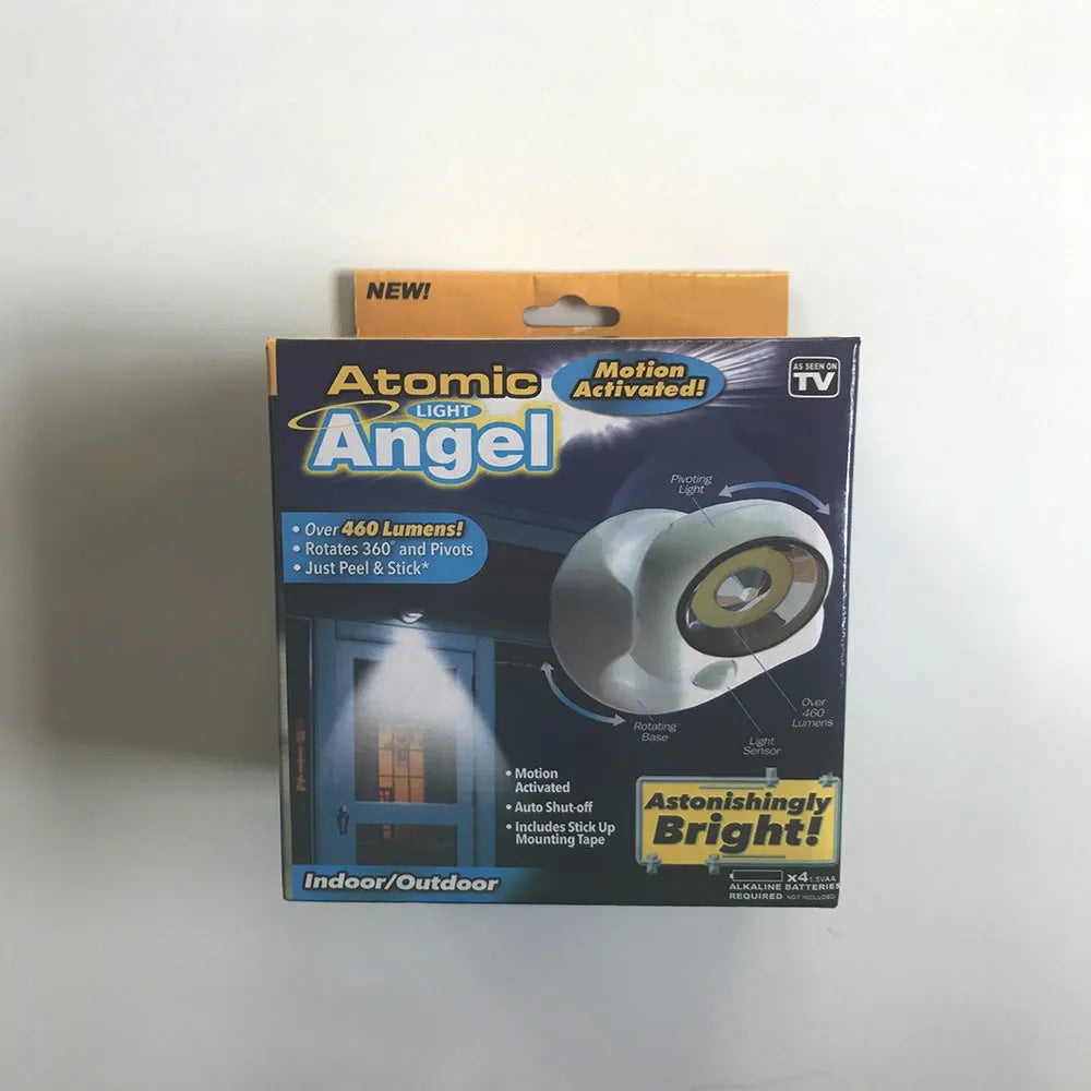 White Atomic Angel cordless induction desk lamp on a surface.