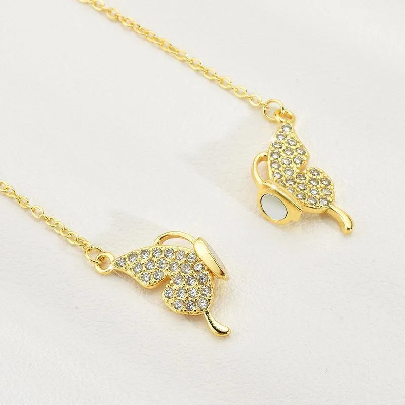 Gold and silver titanium steel twisted chain necklace with magnetic butterfly clasp.