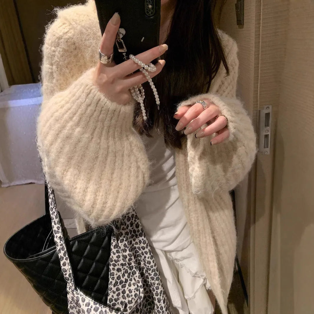 Women's thick grey hooded cardigan sweater with loose fit and regular sleeves