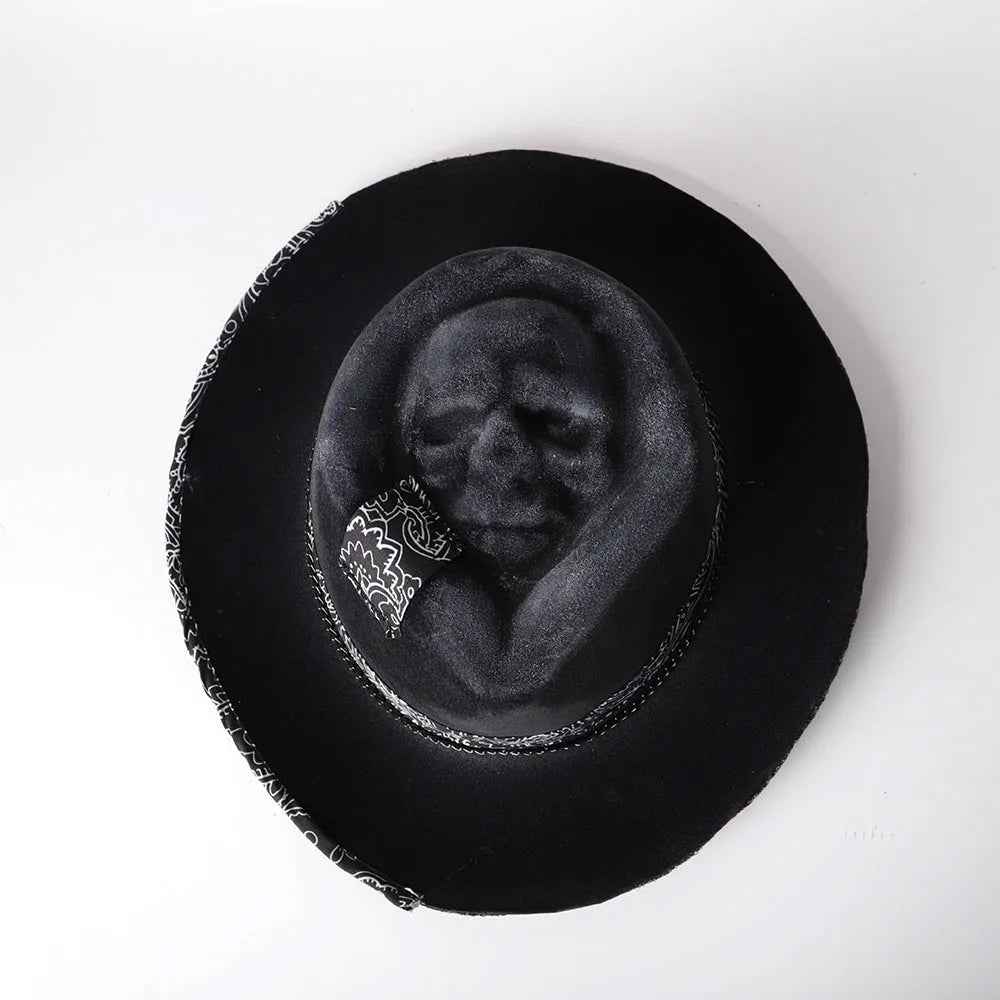 Handmade wool Halloween skull hat with a conical crown on a denim hat base.
