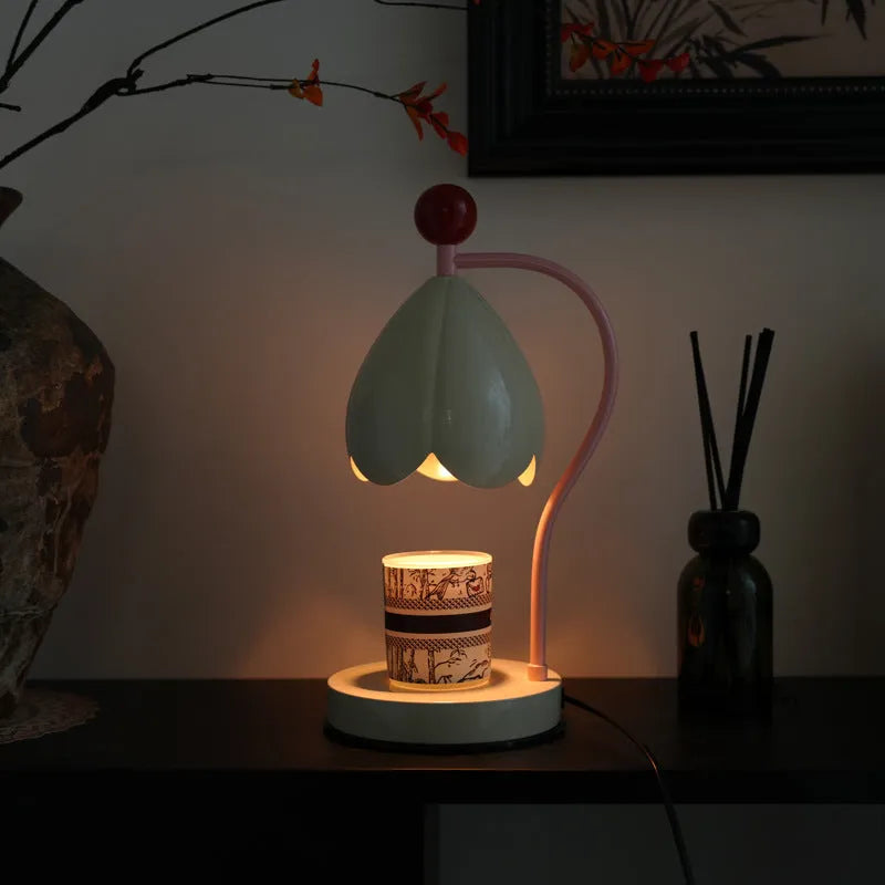 Linglan cream white metal holder melting wax desk lamp on a wooden table.