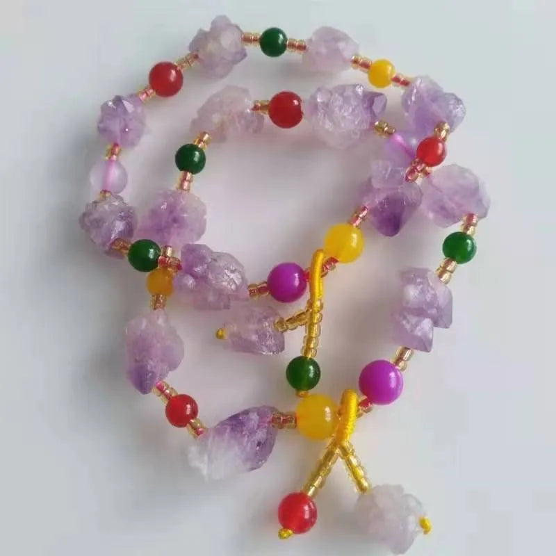 Natural amethyst bracelet with fu charm on woman's wrist
