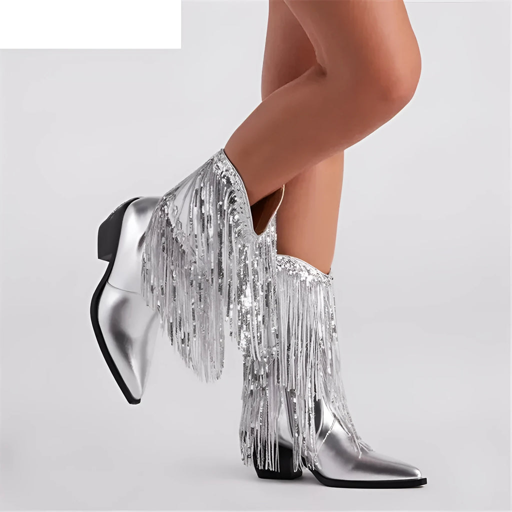 Women's black ankle boots with tassel detail, chunky stiletto heel, and pointed toe on a white background.