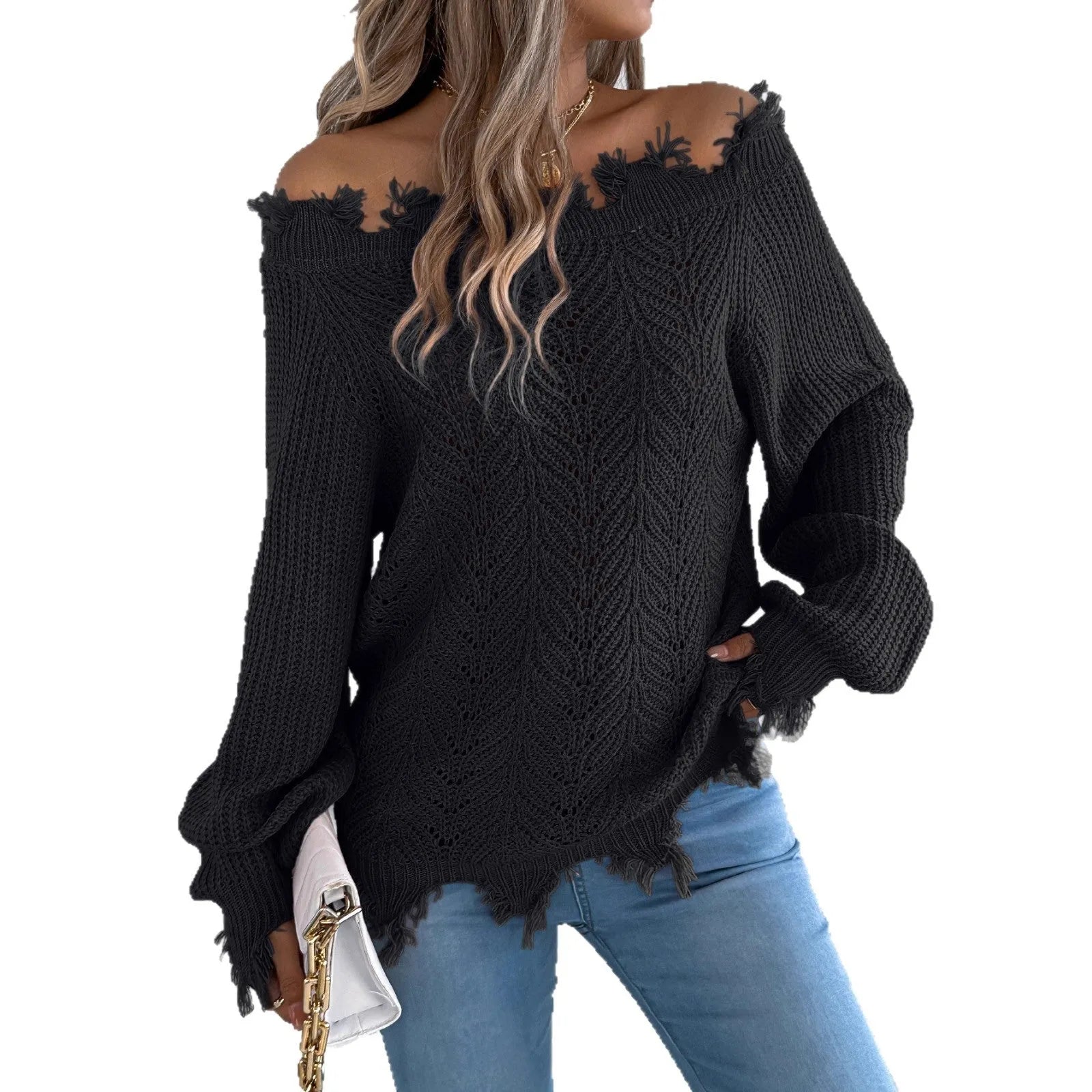 White hollow-out patterned long-sleeved sweater with a cut off-the-shoulder neckline on a model.