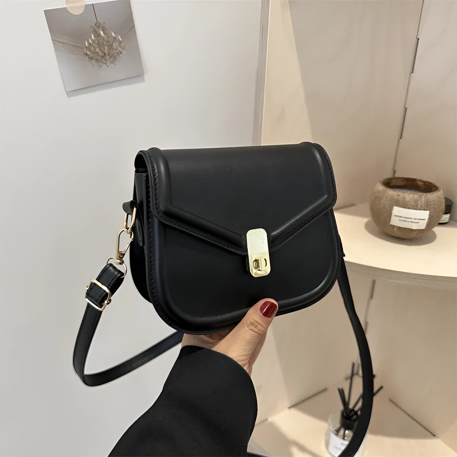 Soft horizontal square messenger bag in clamshell design, shown in black colour.