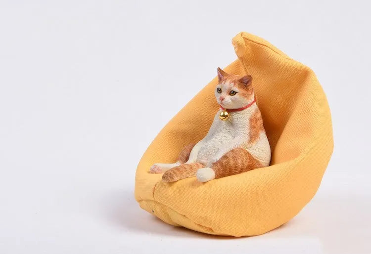 Lazy cat car ornament on sofa, approximately 7.5cm high, made from environmental protection resin with fabric art details