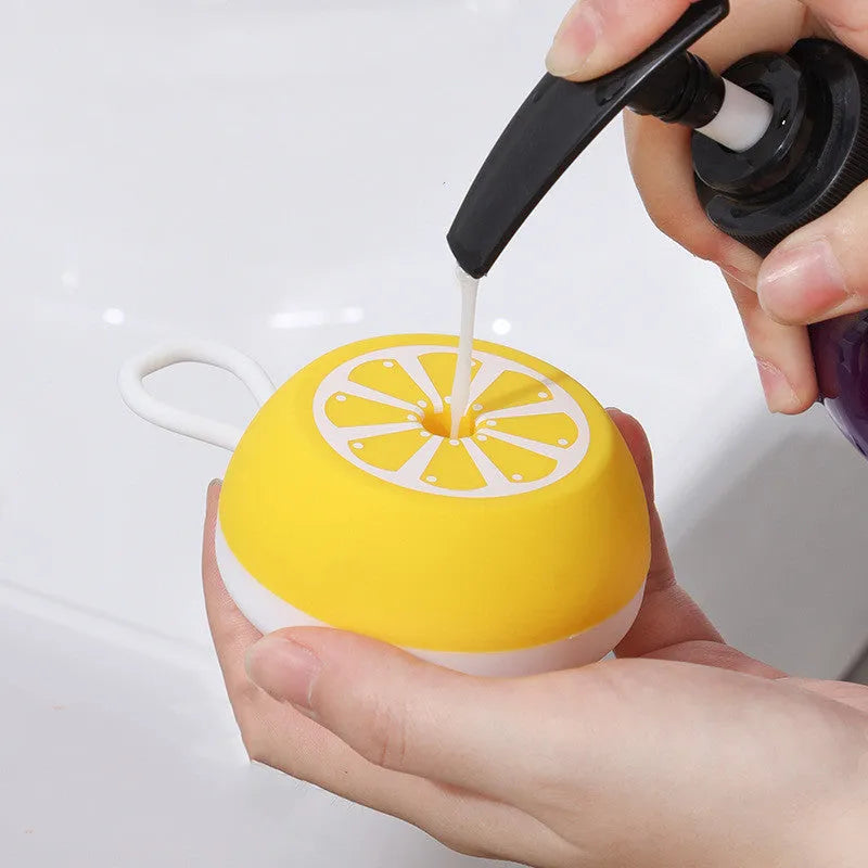Yellow silicone pet bath brush with massage head and comb for dog and cat grooming.