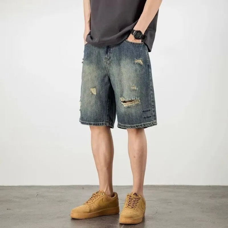 Men's blue retro wash loose fit denim shorts with straight legs on a mannequin.