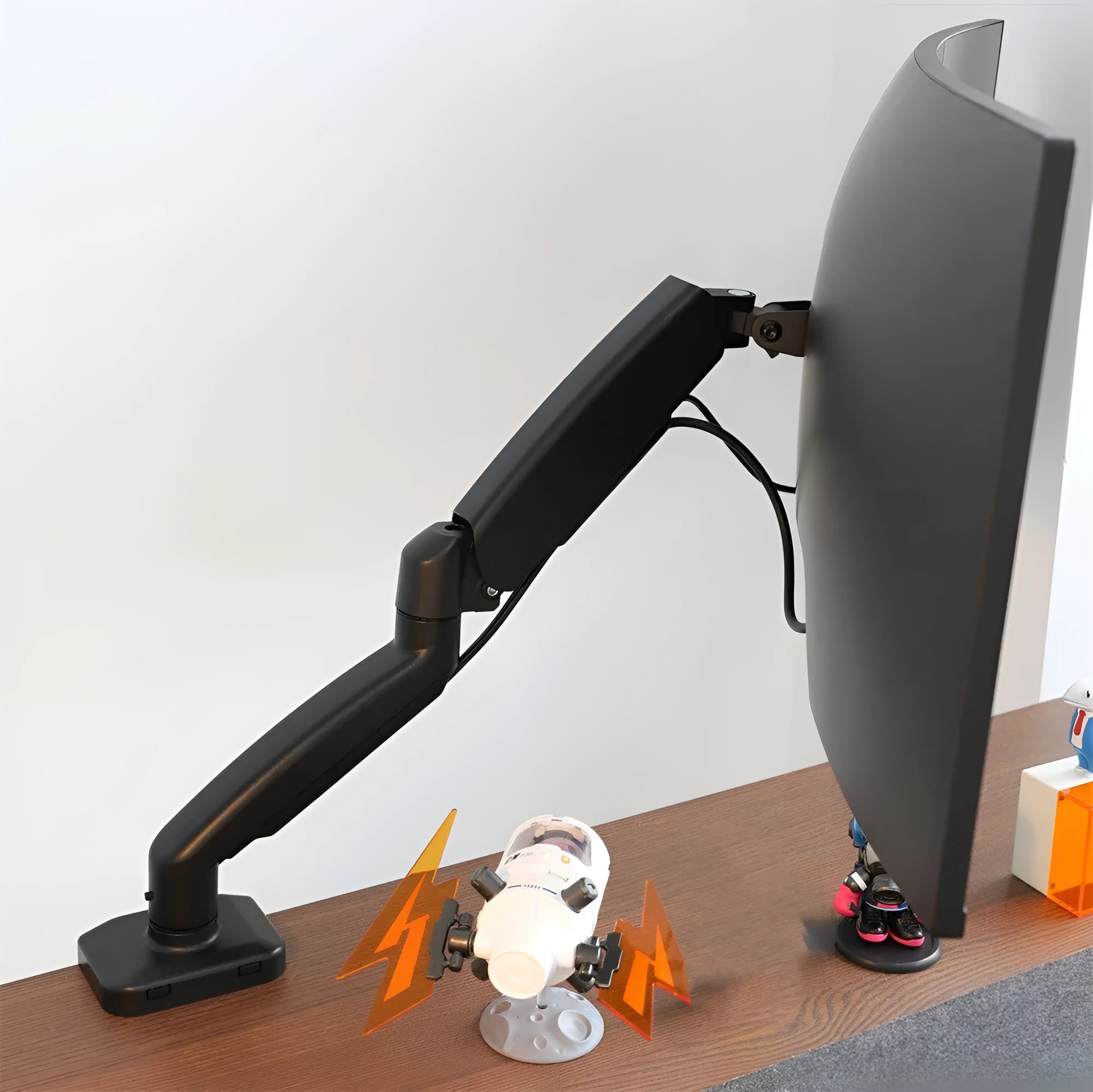 Black and white rotating telescopic LCD screen bracket with metal and aluminium construction on a desk