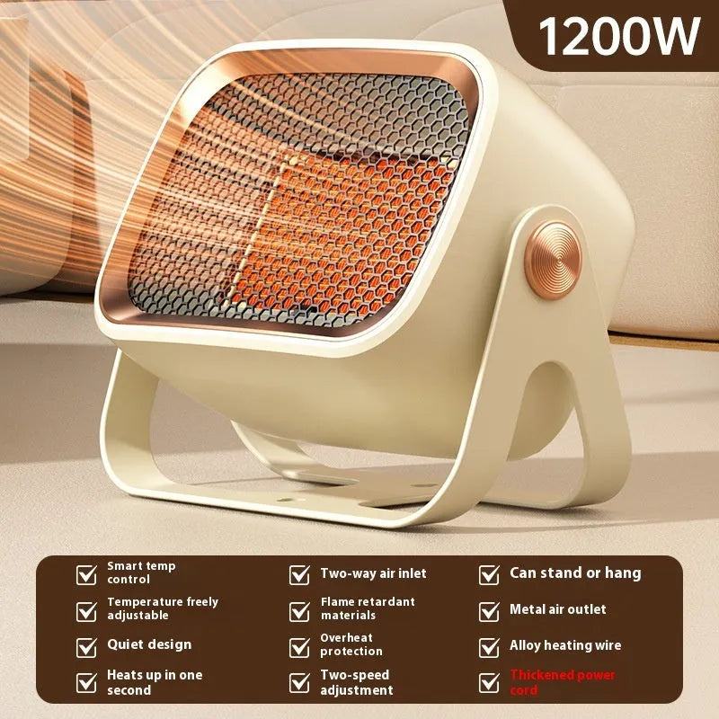 Compact grey desktop ceramic heater with rotatable grill on a wooden desk.