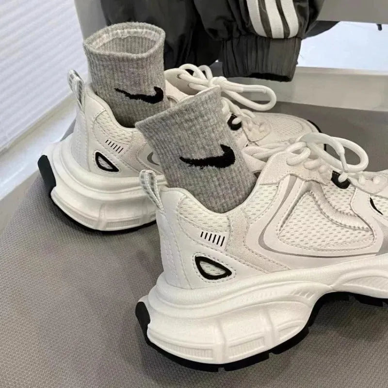 Beige women's mesh platform sports shoes with a wedge heel and lace-up front.