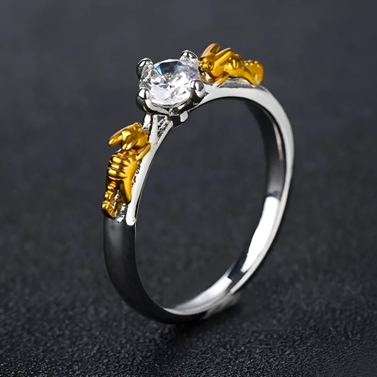 Copper crown cosplay ring with black gold finish and crystal details on a hand.