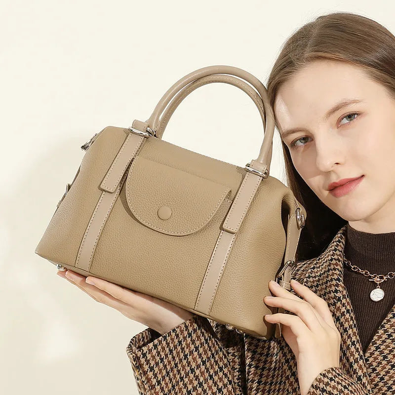 Women's genuine leather handbag in street-trend style with lock closure and contrast stitching