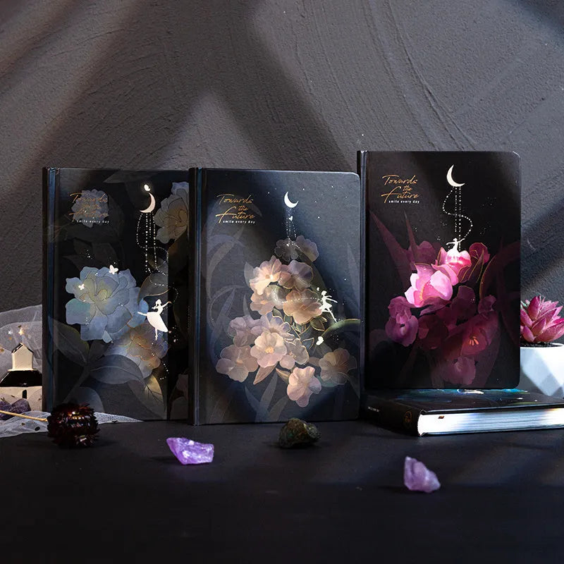 A5 notebook with luminous cover open to show pages filled with colour illustrations