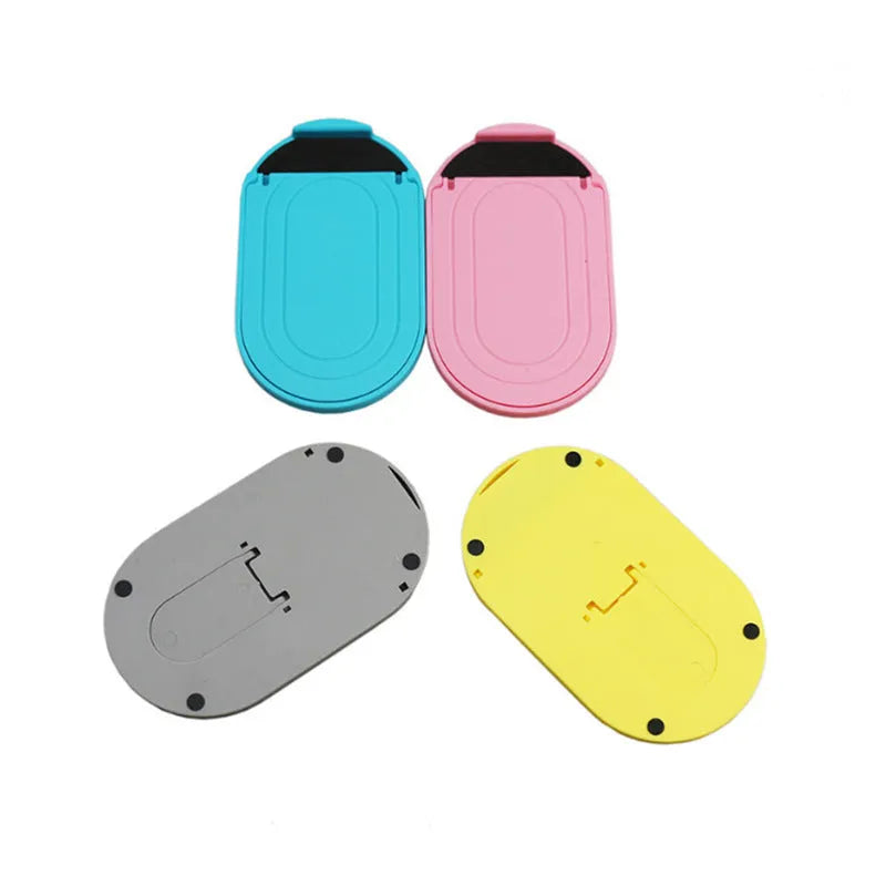 Plastic lazy bracket mobile phone stand in one of six colours: black, blue, grey, pink, white, or yellow.