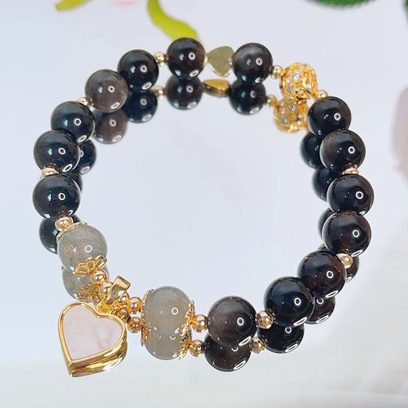 Silver stone bracelet with electroplated finish showing floral, love heart, and star charm designs