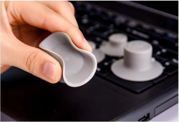 Grey plastic laptop cooling pad stand with 2 large and 2 small risers for better ventilation and viewing angles