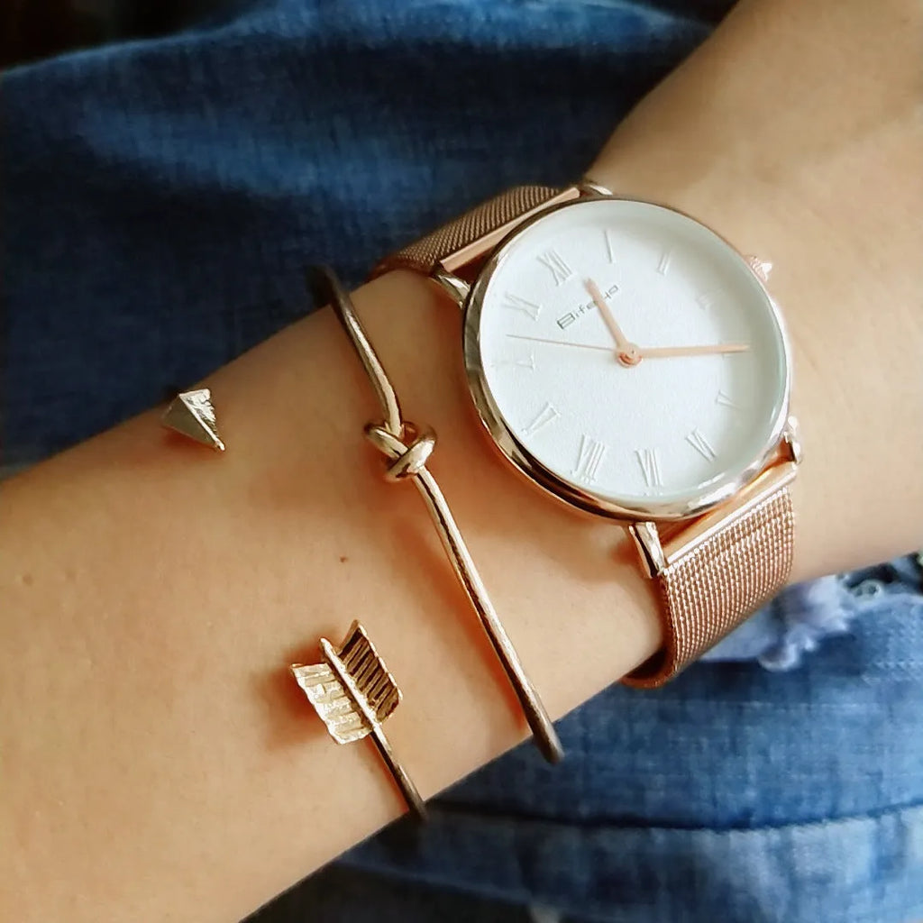Women's vintage cuff bracelet with arrow and knotted design in gold electroplated alloy
