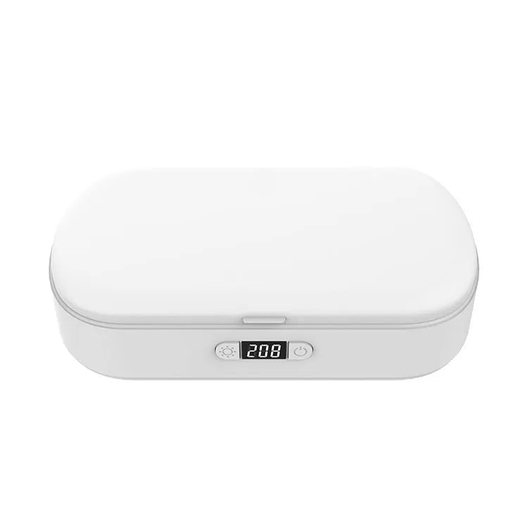 White ultraviolet steriliser box with wireless charging for mobile phones and small items.