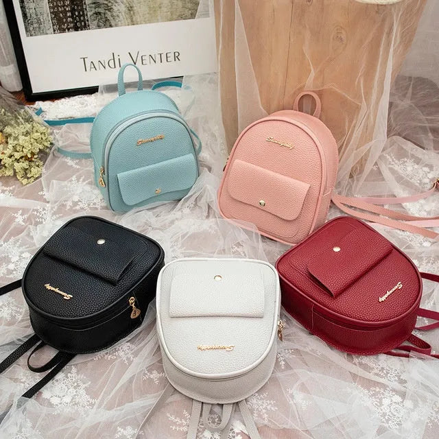 Small PU leather shoulder backpack in black colour showing zipper closure and compact dimensions