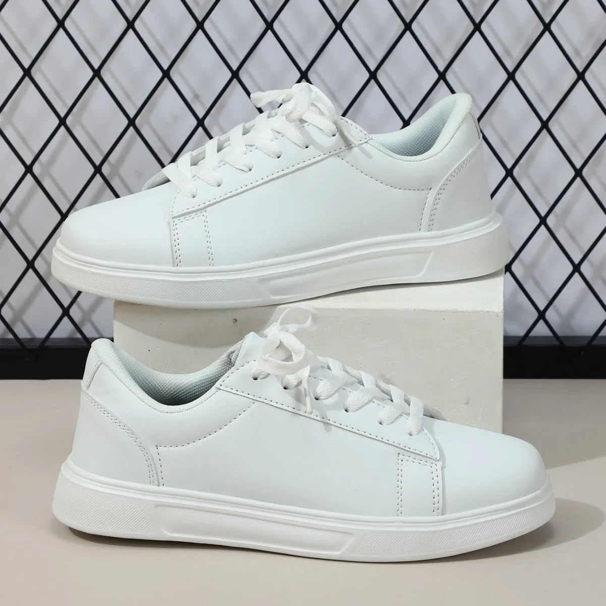 Beige brown platform skateboard sneakers with cross belt design and rubber sole
