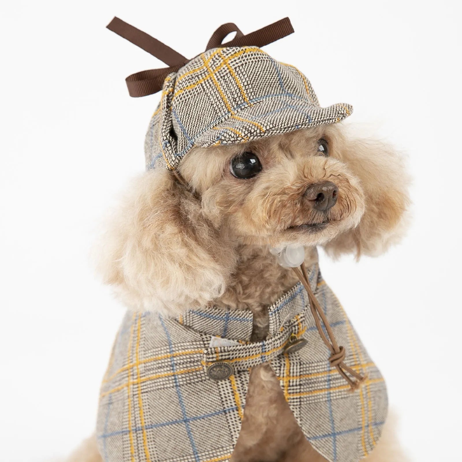 Camel-coloured cotton detective cloak for a dog on a mannequin, showing the hood with adjustable hat.