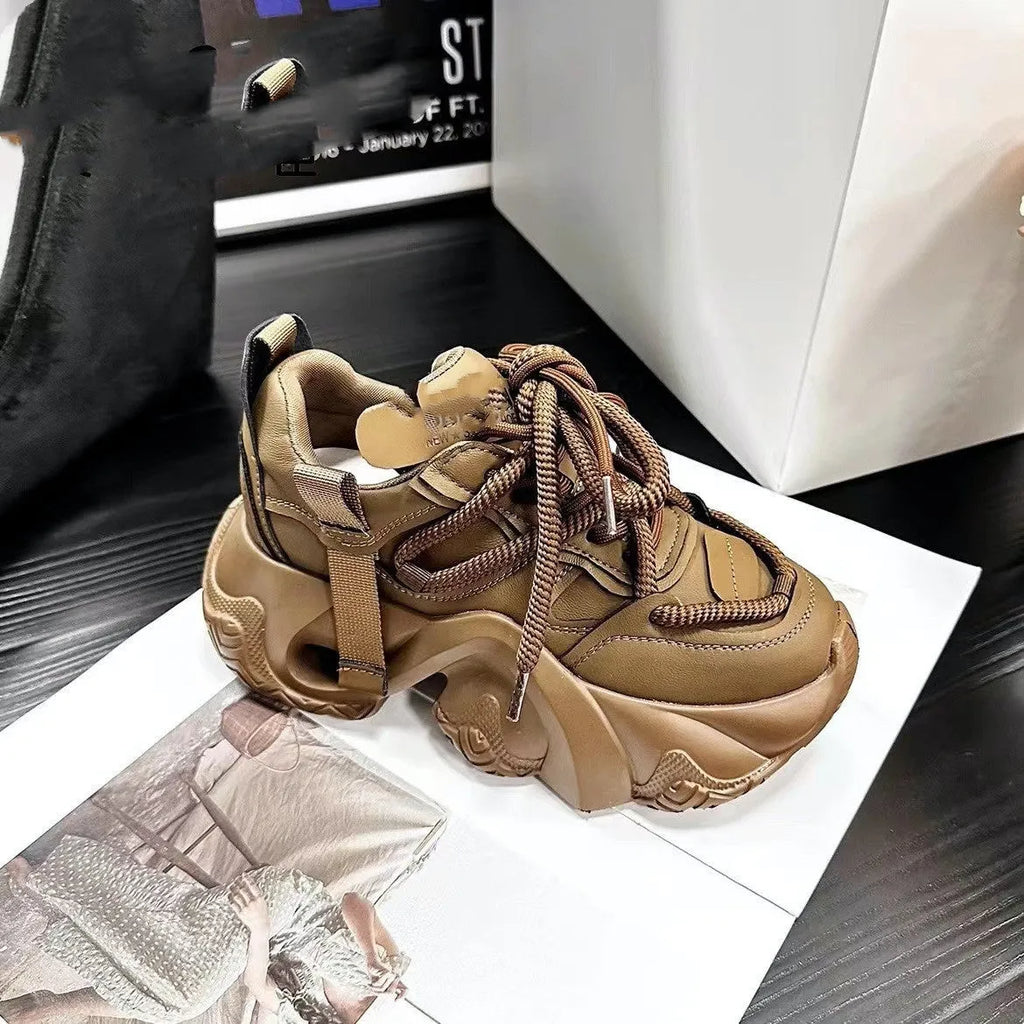 Women's low-top wedge sneakers in creamy white with cross-straps and a front lace-up design.