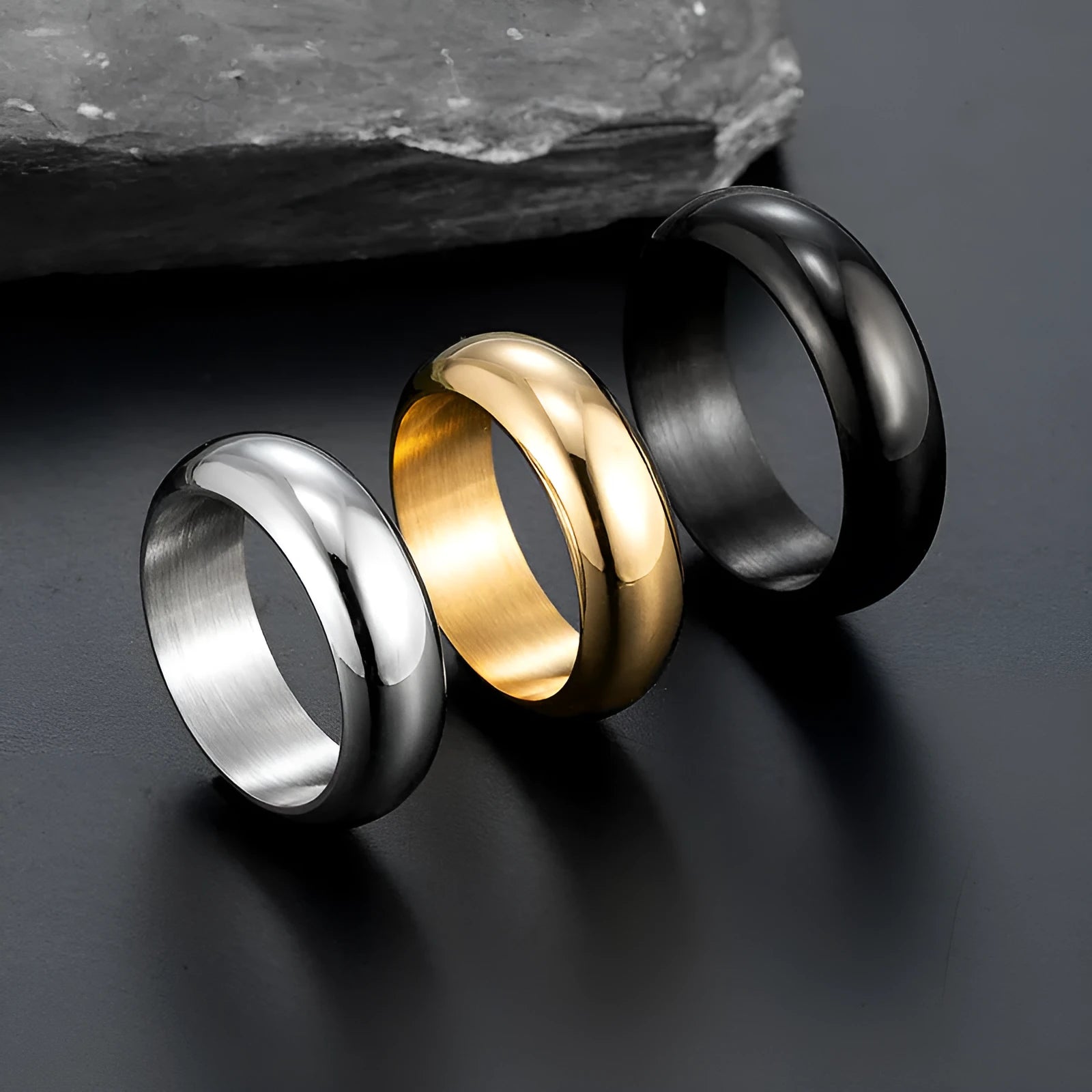 Glossy electroplated titanium steel ring in gold, black, and steel colour options showing polished finish