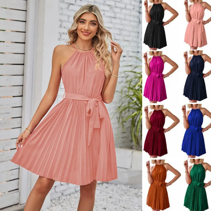 Women's black halter neck strapless sundress with a pleated midi skirt and waist tie