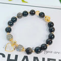 Silver stone bracelet with electroplated finish showing floral, love heart, and star charm designs