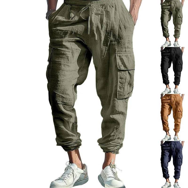 Men's solid colour linen casual trousers with ankle ties and drawstring waist on hanger.