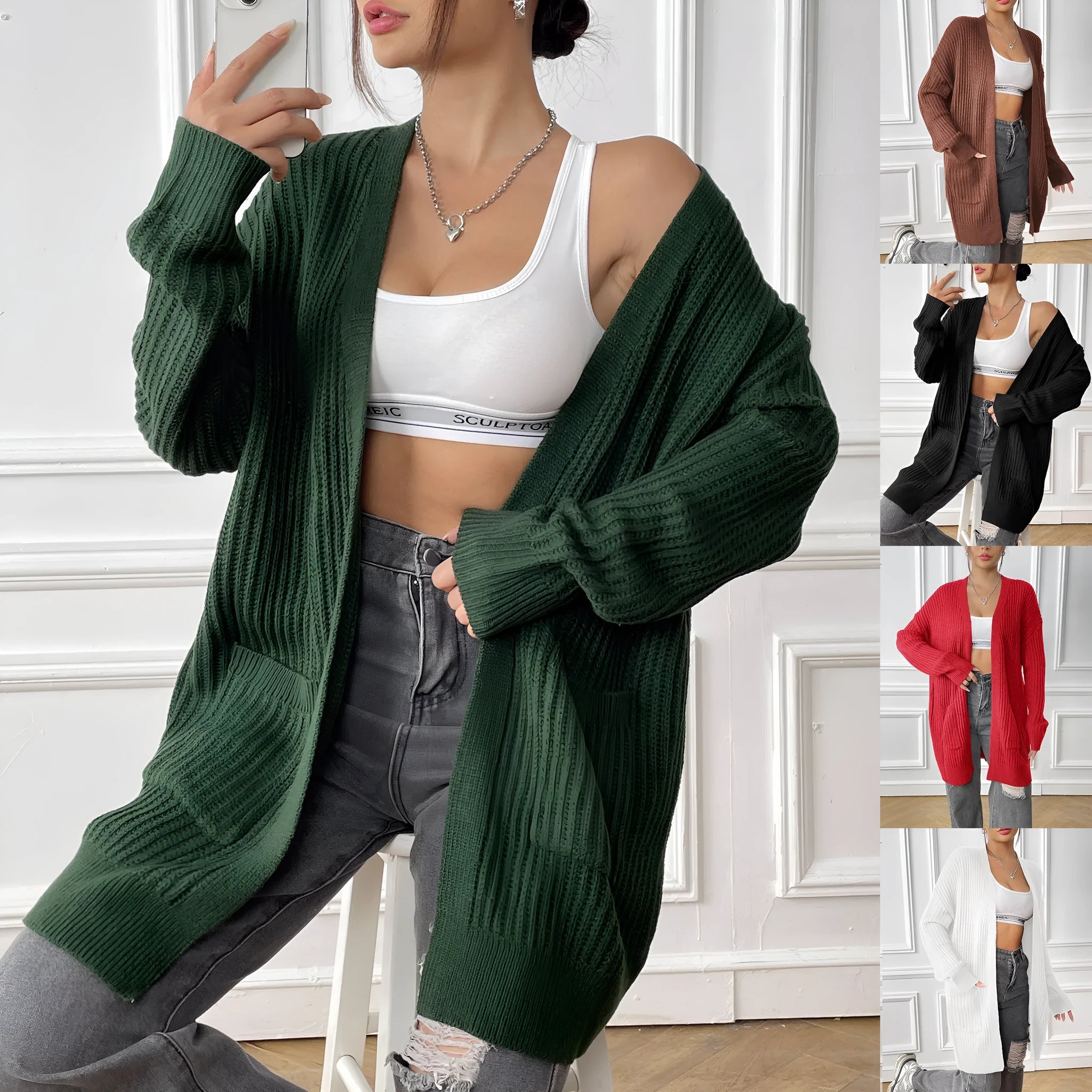 Women's dark green loose fit acrylic cardigan sweater with double pockets and long sleeves.