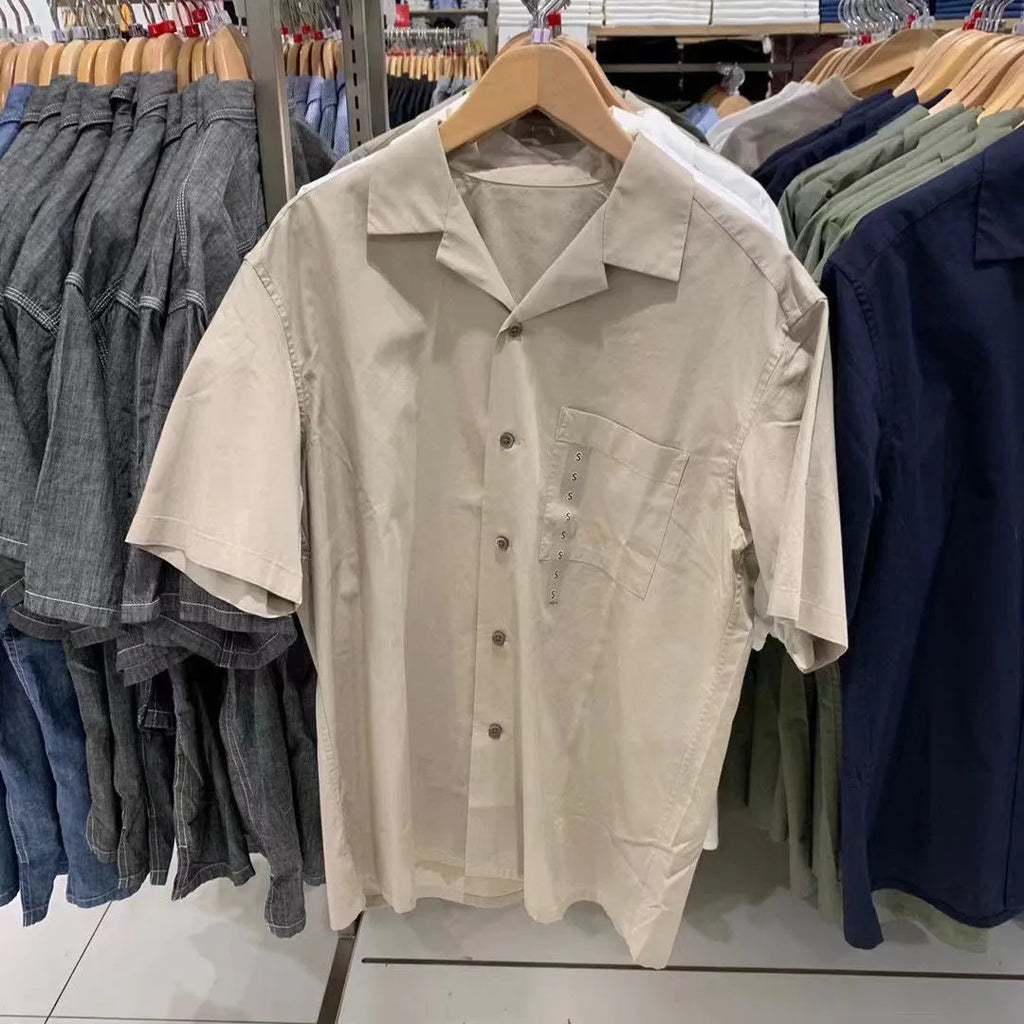 Man wearing a beige modal cotton open collar cardigan-style casual shirt.