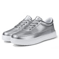 Women's white leather lace-up casual flat shoes on a solid background