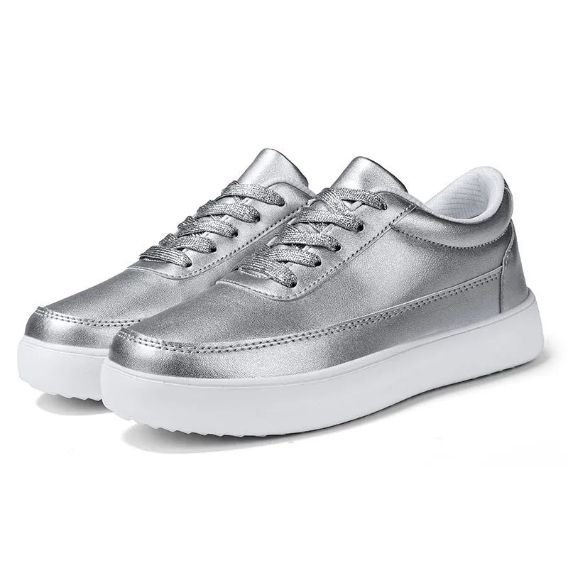 Women's white leather lace-up casual flat shoes on a solid background