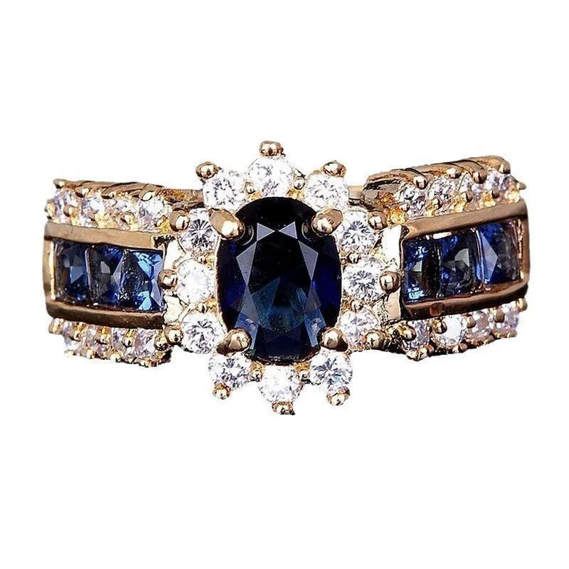Zinc alloy personalised ring showing sunflower blue diamond and square-cut blue and purple zircon designs.