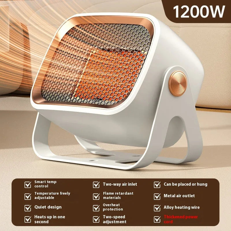 Compact grey desktop ceramic heater with rotatable grill on a wooden desk.