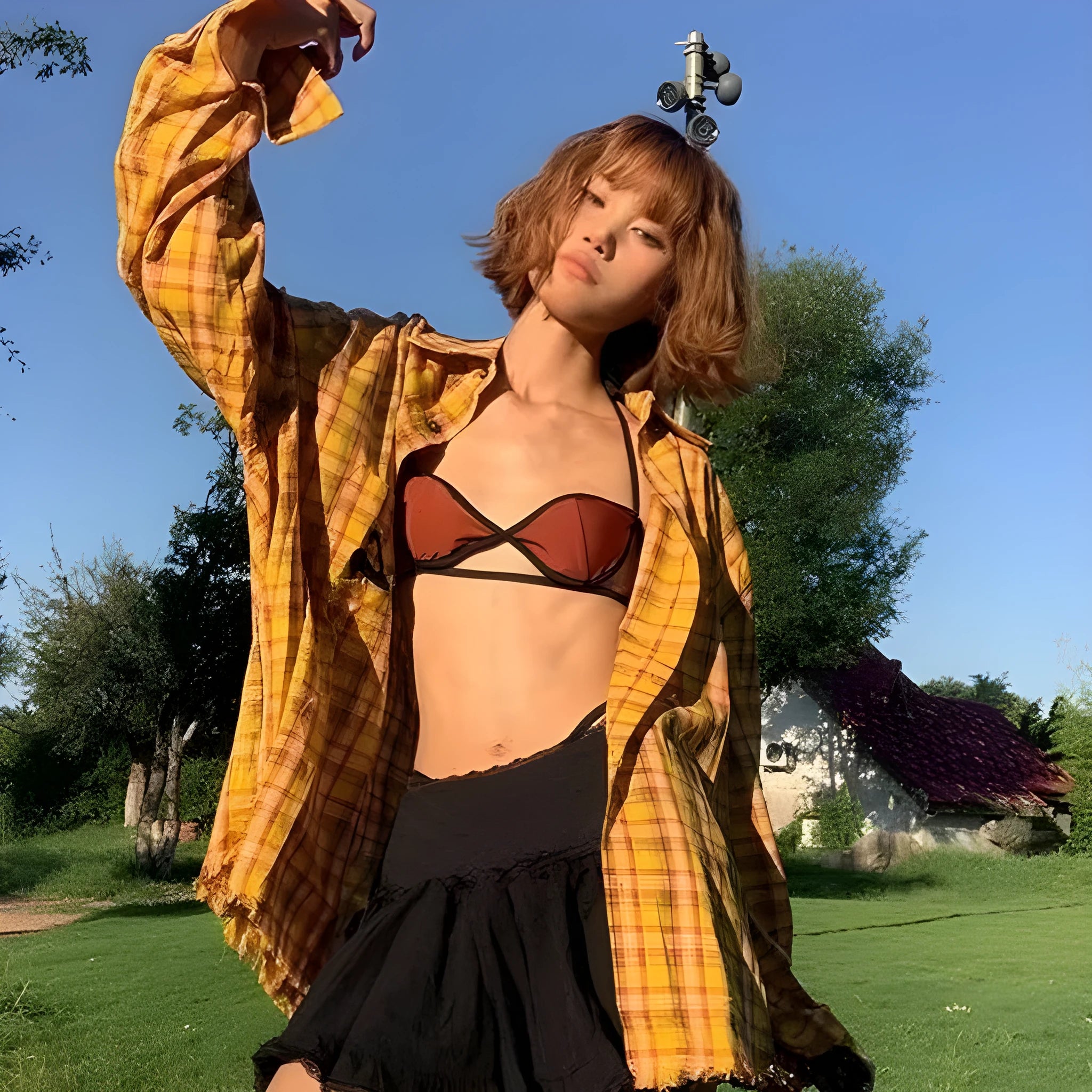 A loose-fitting dopamine yellow and black plaid cardigan-style shirt for men and women.