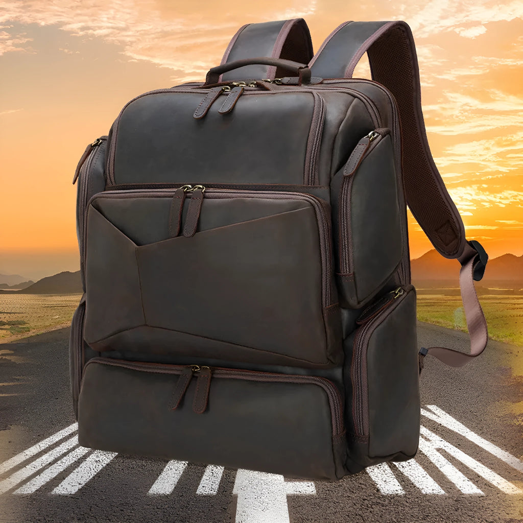 Dark brown retro crazy horse leather backpack for a 17-inch laptop, showing double shoulder straps and external pockets.