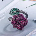 Black gold geometric flower ring with simulated red corundum centrepiece on copper base