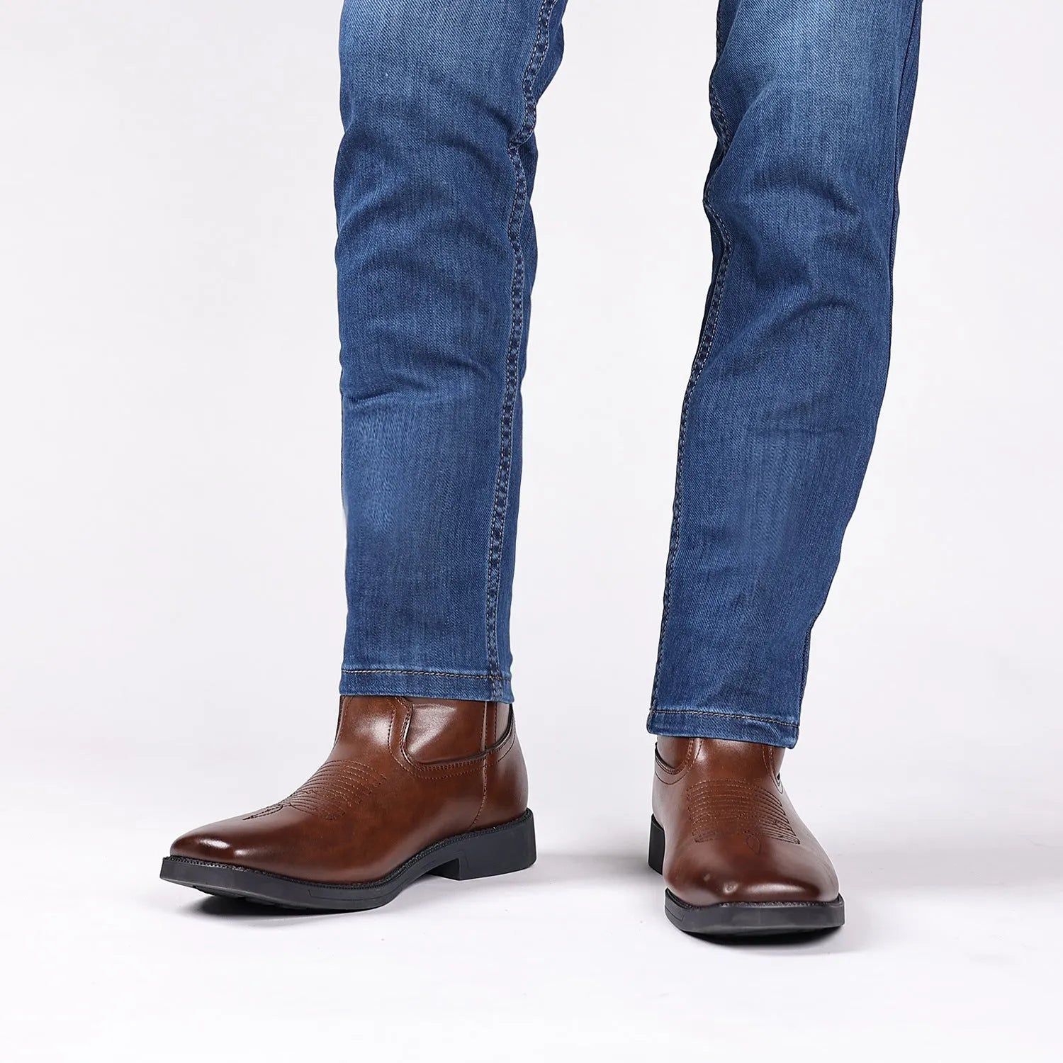 Men's brown retro cowboy boots with wide head design, high shaft, and horseshoe heel