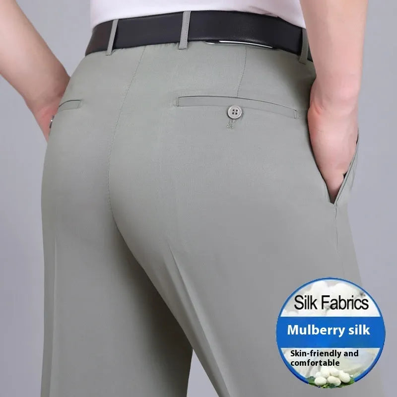 Men's straight cut black mulberry silk blend business trousers with high waist on a hanger.