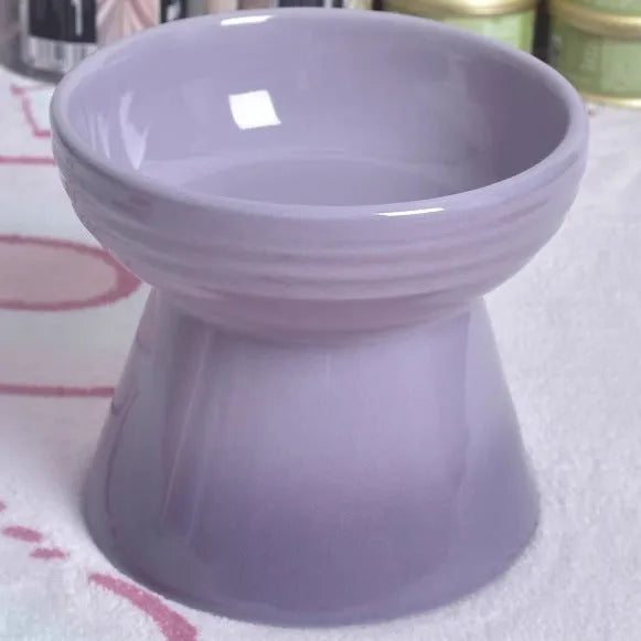 Ceramic pet bowl with high foot design showing anti-tumble stability feature