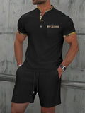 Men's grey zip-front polo collar short sleeve top paired with matching shorts, a casual summer suit set.