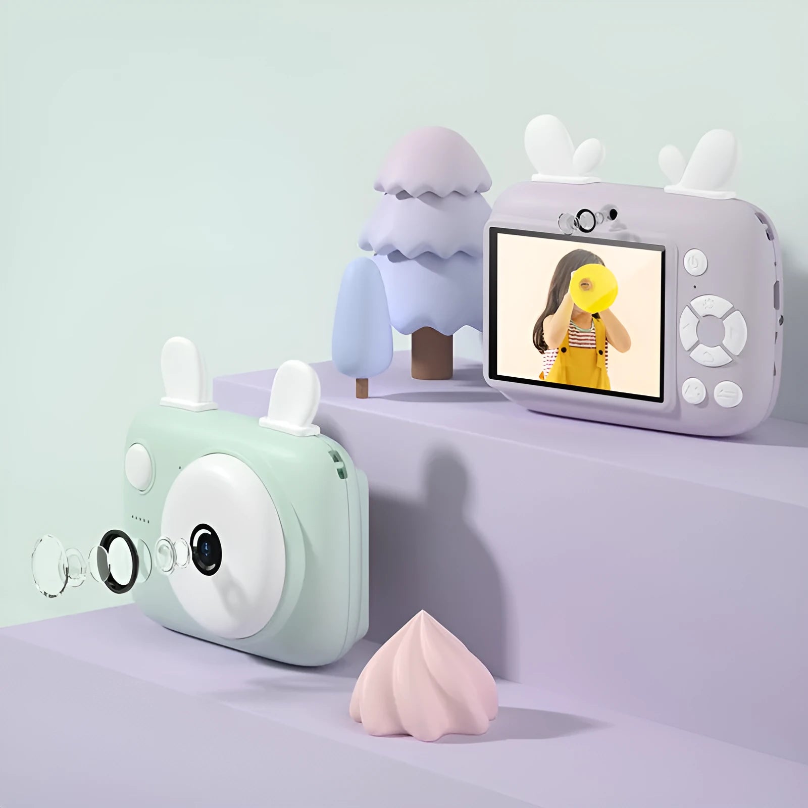 A2 Kids Photo Camera in macaron colours with 2.4-inch screen, dual lenses, and attached lanyard.