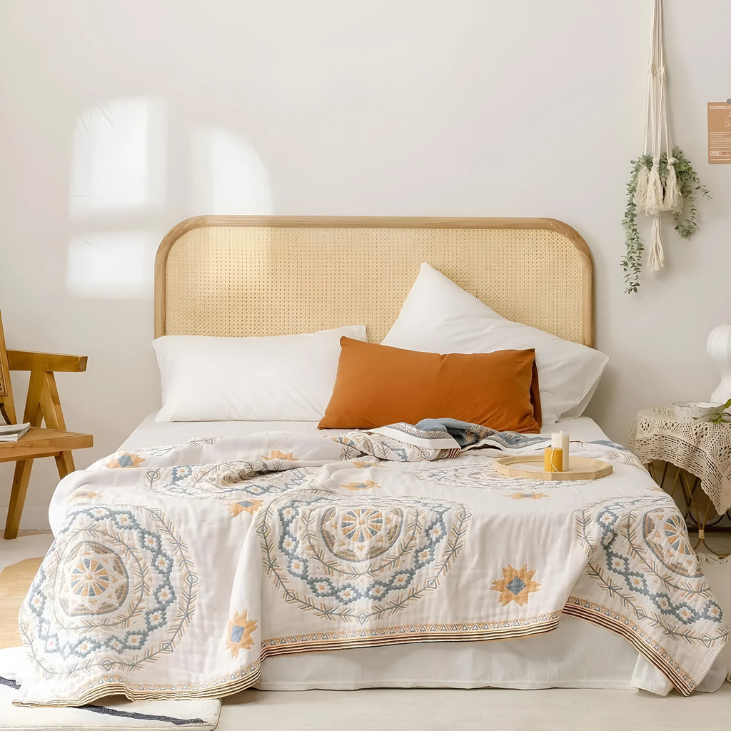 Geometric patterned cotton towel blanket laid flat, showing its modern design and soft texture.